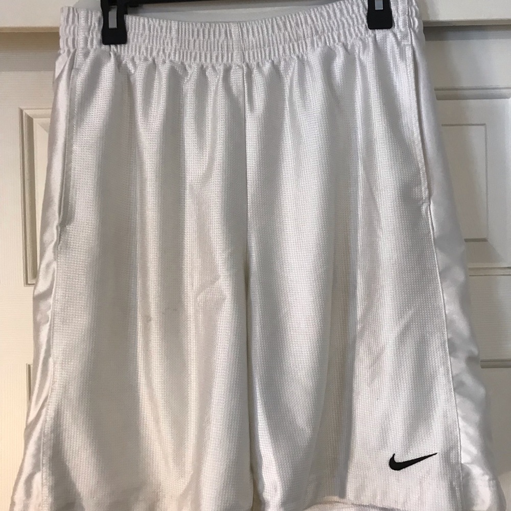 Men’s white Nike basketball shorts (M)